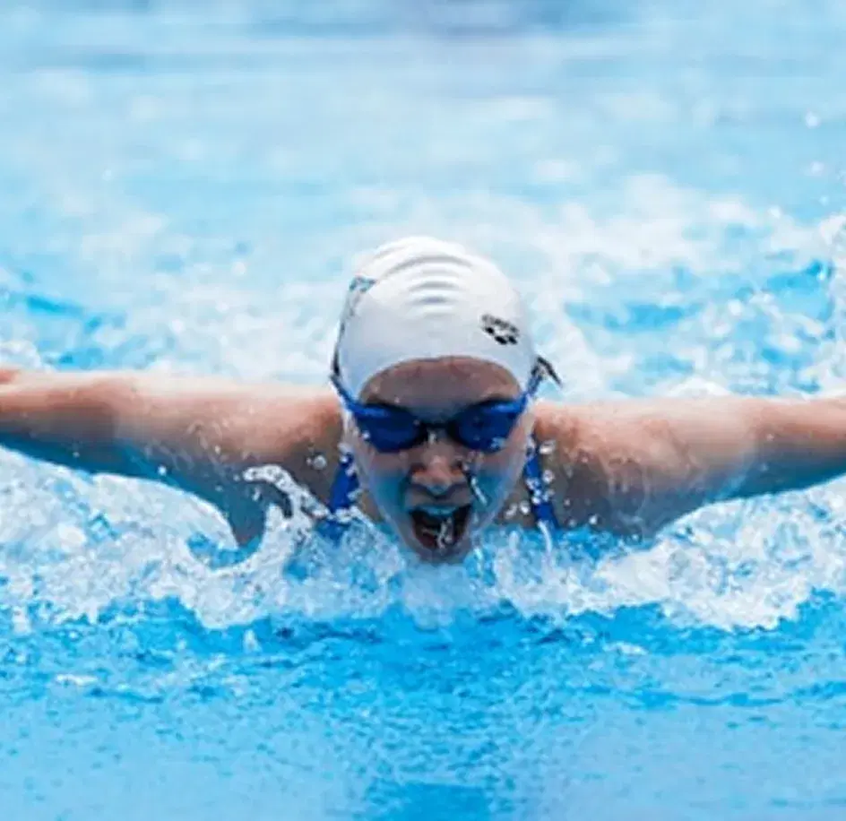 Swimmer mid butterfly stroke